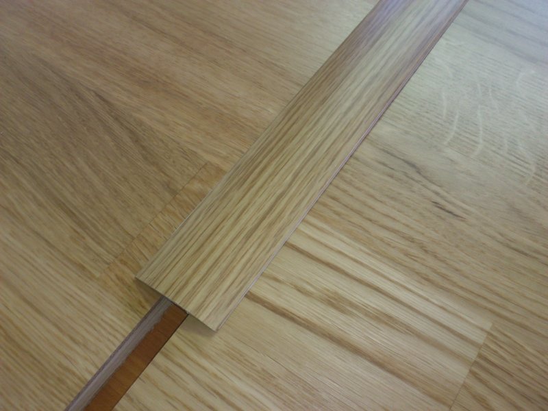 Přechodové lišty k dřevěným podlahám